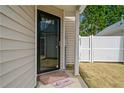 Inviting front entrance with a black framed glass door, small brick steps, and a welcoming mat at 2365 Parkside Club Ln, Lawrenceville, GA 30044
