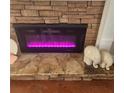 Modern electric fireplace insert with stone surround and display ledges at 25 Cherokee Hills Dr, Rydal, GA 30171