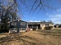 Charming two-story home features a combination of stone and siding exterior with a well-maintained front yard at 3633 Mill Glen Dr, Douglasville, GA 30135