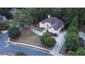 Aerial view showcasing this elegant, single-story home with mature landscaping and a generous driveway at 433 Abbey Springs Way, Mcdonough, GA 30253