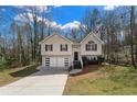 Charming two-story home featuring a two-car garage and well-manicured landscaping at 445 Settlers Ridge Ln, Hiram, GA 30141