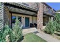Exterior entrance of the property featuring covered patio and landscaping at 3071 Colonial Way # J, Atlanta, GA 30341
