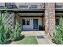 Exterior entrance of the property featuring covered patio and landscaping at 3071 Colonial Way # J, Atlanta, GA 30341