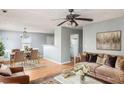Open-concept living and dining area featuring modern decor, hardwood floors and ample natural light at 72 Polar Rock Rd, Atlanta, GA 30315