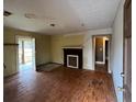 Incomplete living room showing the doorway to the backyard and an old fireplace at 1458 Olive Sw St, Atlanta, GA 30310
