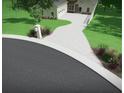 Charming home with a long driveway and well-manicured lawn showcasing a welcoming entrance at 7065 Walnut Mill Ct, Cumming, GA 30040
