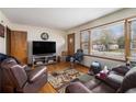 Comfortable living room with hardwood floors and plenty of natural light, creating a warm and inviting atmosphere at 965 Laurel St, Morrow, GA 30260