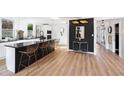 Spacious kitchen with sleek black countertops, stainless steel appliances, and island seating at 2824 Tupelo Se St, Atlanta, GA 30317