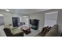 Inviting living room with modern flooring, a TV, and lots of natural light at 4252 Parkview Ct, Stone Mountain, GA 30083