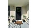 Welcoming front entry with a decorative wreath and potted plants at 851 Daniell Se Dr, Smyrna, GA 30080