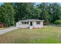 Single story home with a well-manicured front yard and exterior finishes at 851 Daniell Se Dr, Smyrna, GA 30080