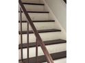 Staircase featuring decorative woodwork and paint at 1110 Country Ct, Lawrenceville, GA 30044