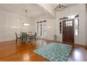 Elegant dining room with hardwood floors, a decorative rug and abundant natural light at 6029 Shadburn Ferry Rd, Buford, GA 30518