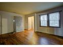 Bedroom with natural light, hardwood flooring, awaiting new decor to bring out its potential at 1347 Westmont Sw Rd, Atlanta, GA 30311