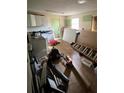 Kitchen with cabinets and appliances amid renovation or construction materials and tools at 2836 Oldknow Dr, Atlanta, GA 30318