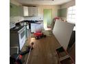 View of a kitchen undergoing renovation with cabinets and an older oven and stove combo at 2836 Oldknow Dr, Atlanta, GA 30318