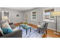Bright living room with hardwood floors, comfortable seating and serene, neutral decor at 422 Derbyshire Dr, Stone Mountain, GA 30088