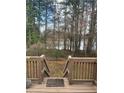 Wooden deck overlooking a treed backyard, offering outdoor living at 361 Oak Harbor Trl, Marietta, GA 30066