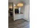 Dining area features modern lighting fixture and hardwood flooring at 361 Oak Harbor Trl, Marietta, GA 30066