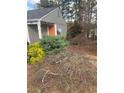 Charming home exterior with well-maintained landscaping and colorful plants at 361 Oak Harbor Trl, Marietta, GA 30066