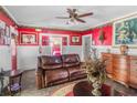 Inviting living room featuring a comfortable leather couch, ornate decor, and a warm atmosphere at 799 Moreland Se Ave, Atlanta, GA 30316