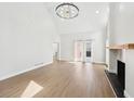 Spacious living area with fireplace and bright, neutral color palette for versatile decor options at 1600 Spring Arbor Sw Ct, Lilburn, GA 30047