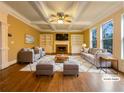 Cozy staged living room with fireplace, built-in shelves, and ample seating at 6111 Sequoia Ln, Douglasville, GA 30135