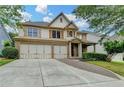 Attractive two-story home with a three-car garage, brick facade, and well-maintained landscaping at 3305 Suffolk Dr, Cumming, GA 30041
