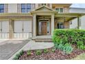 Inviting front porch with brick accents, a covered entrance, and lush landscaping at 3305 Suffolk Dr, Cumming, GA 30041