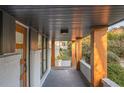 View of the home's covered front porch with natural wood columns at 3388 Hyland Dr, Decatur, GA 30032
