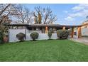 Charming single-story home with a well-manicured lawn and inviting facade at 3388 Hyland Dr, Decatur, GA 30032