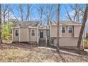 Inviting home featuring a quaint front entrance with wood stairs, complemented by a neutral-toned siding at 6739 Valley Ct, Douglasville, GA 30135