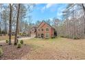 Well-maintained two-story brick home featuring a spacious yard and two car garage at 1705 Butler Bridge Rd, Covington, GA 30016