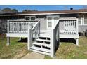 A spacious back deck provides an ideal space for outdoor entertaining and relaxation, overlooking the backyard at 123 Oldenburg Dr, Riverdale, GA 30274