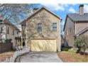A detached two-car garage sits at the end of a long driveway at 1596 Baxley Pine Trce, Suwanee, GA 30024