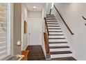 Light and bright entryway with wooden floors, staircase, and white doors at 215 Arizona Ne Ave # 1, Atlanta, GA 30307