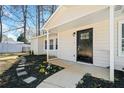 A welcoming porch with updated landscaping, new mulch, and a modern front door at 3435 Stallion Ct, Powder Springs, GA 30127