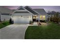 Beautiful single-Gathering home at dusk, featuring a 2-car garage and manicured lawn at 41 Balsam Dr, Dallas, GA 30157