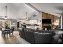 Spacious living room features a stone fireplace and opens to the kitchen and dining area at 3747 Junior Ln, Douglasville, GA 30135