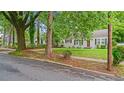 Inviting one-story home with well-kept lawn and traditional design on a tree-lined street at 1132 Fair St, Atlanta, GA 30314