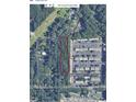 Aerial view of parcel outlined in red with neighborhood context, showing property's proximity to Stone Rd and Beech Dr at 2469 Stone Rd, East Point, GA 30344