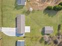 An aerial view of a home showcasing the yard, driveway, and shed on a sunny day at 708 Morris Rd, Hiram, GA 30141