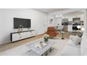 Stylishly furnished living room with modern decor, open to the bright kitchen, perfect for entertaining at 1894 Evans Sw Dr, Atlanta, GA 30310