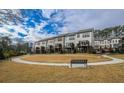 Townhouse community featuring a manicured green space and walking paths at 4191 Wisconsin Dr, Dunwoody, GA 30338