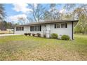 Attractive single-story house featuring a neat lawn and classic black shutters at 4611 Old Westside Rd, Austell, GA 30106