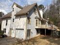 Back exterior view of home with multiple windows and a backyard deck at 4508 Bankside Court, Marietta, GA 30066