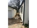 Shot of the side of the home showing sidewalk and new back deck at 684 S Hairston Rd, Stone Mountain, GA 30088