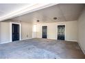 Spacious carport with three entry doors and ample parking for vehicles and storage at 5305 Pilgrim Point Rd, Cumming, GA 30041