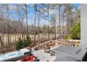 Stunning outdoor space featuring a hot tub, waterfall, fire pit, and view of the golf course at 78 Cuthbert Ln Ne, Acworth, GA 30101