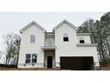 Two-story home featuring white siding and a two-car garage situated on a lot with new construction wrapping at 120 Cedar Cliff Ct, Temple, GA 30179